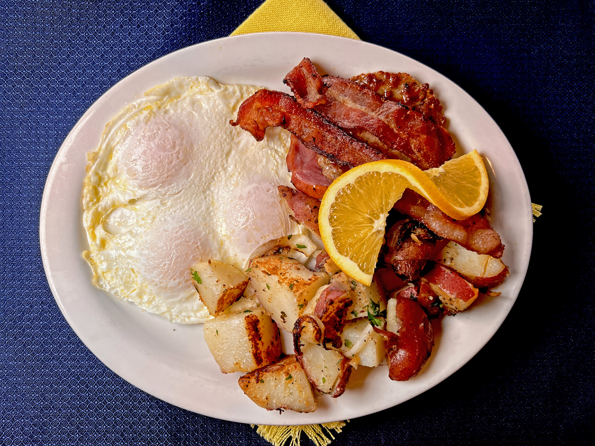 Roested Potatoes With Overeasy Eggs Bacon Pancakes Full